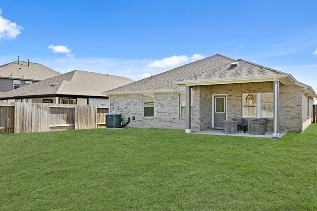 a view of a house with a big yard