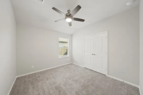 a bathroom with a sink a toilet and a large mirror