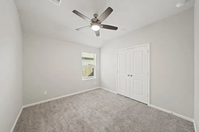 a bathroom with a sink a toilet and a large mirror