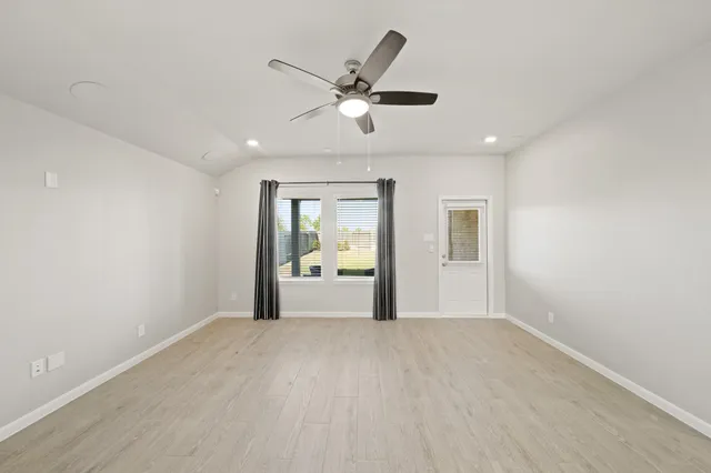 a view of an empty room with a window