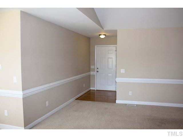 462 Axum Road Willow Spring, NC 27592 - Photo 3 of 18 As you enter the front door, the foyer greets you with warm hardwood floors and is wrapped with a chair rail. Foyer