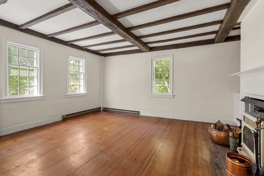 495 Edmands Road Framingham, MA 01701 - Photo 14 of 39 a view of an empty room with wooden floor and a window