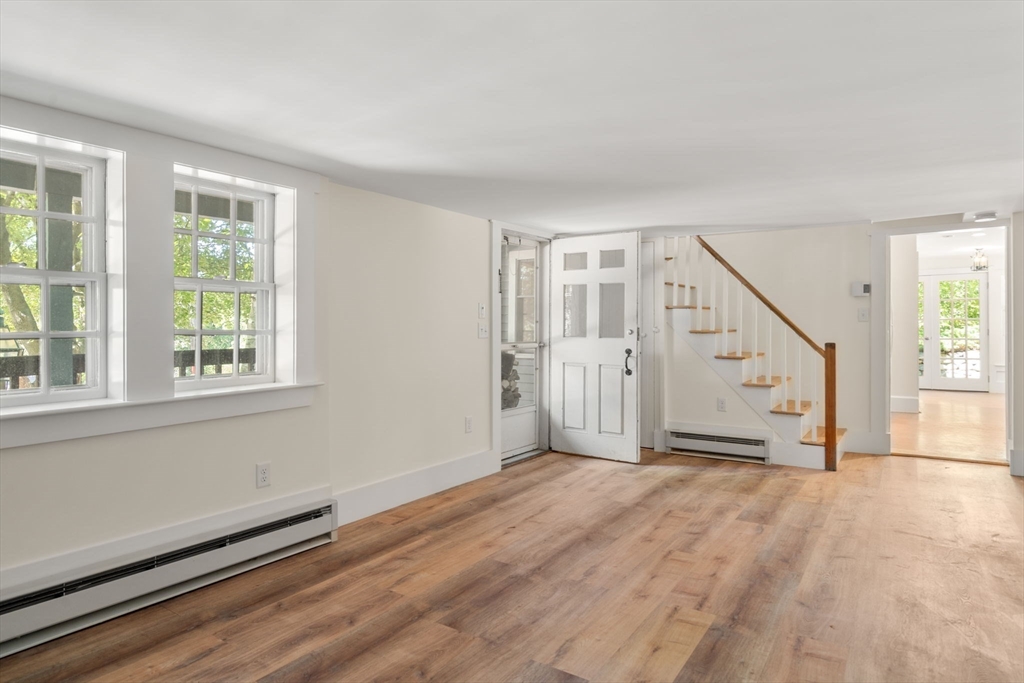 495 Edmands Road Framingham, MA 01701 - Photo 24 of 39 a view of a livingroom with wooden floor and stairs