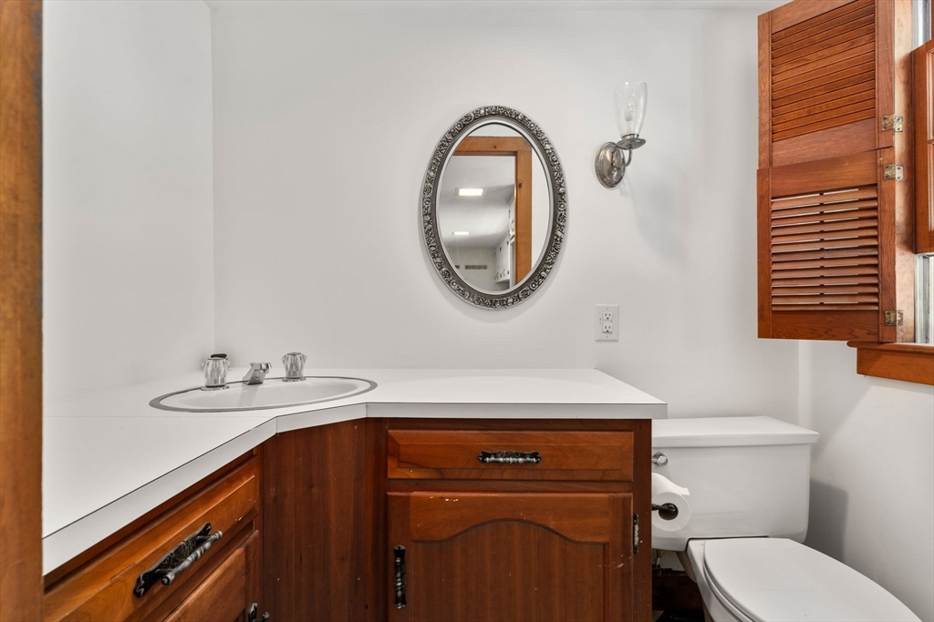 495 Edmands Road Framingham, MA 01701 - Photo 28 of 39 a bathroom with a sink a toilet and a mirror