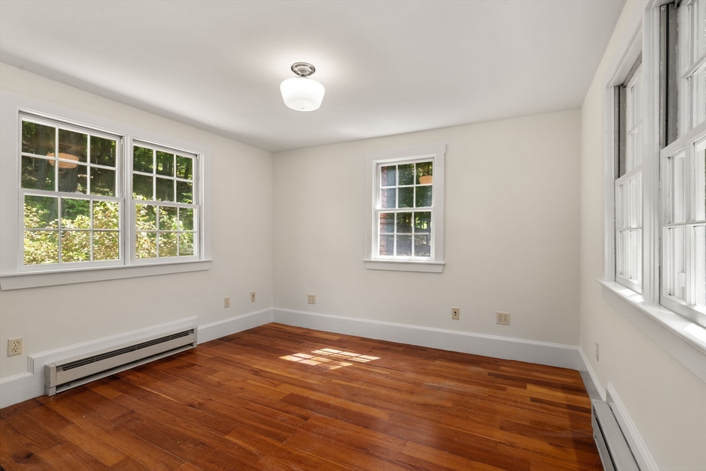 495 Edmands Road Framingham, MA 01701 - Photo 30 of 39 an empty room with wooden floor and windows