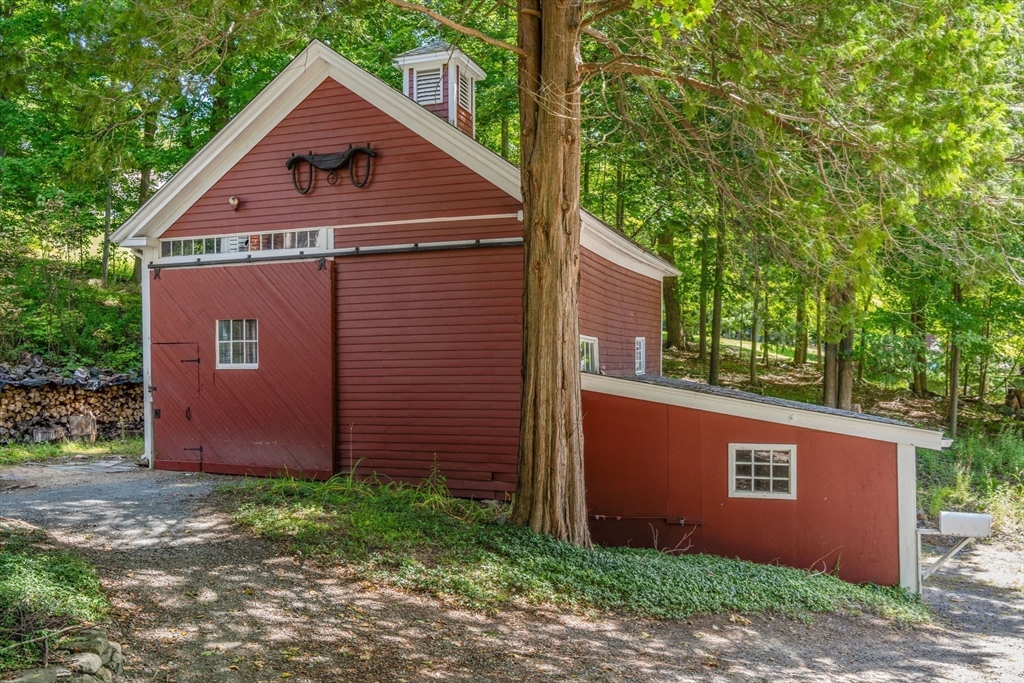 495 Edmands Road Framingham, MA 01701 - Photo 3 of 39 a view of a yard in front of a house with large tree