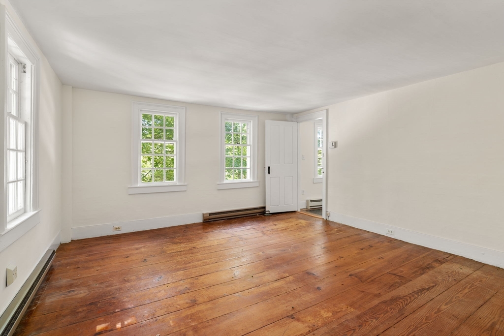 495 Edmands Road Framingham, MA 01701 - Photo 33 of 39 an empty room with wooden floor and windows