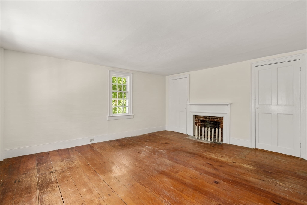 495 Edmands Road Framingham, MA 01701 - Photo 34 of 39 a view of an empty room with a window and a fireplace
