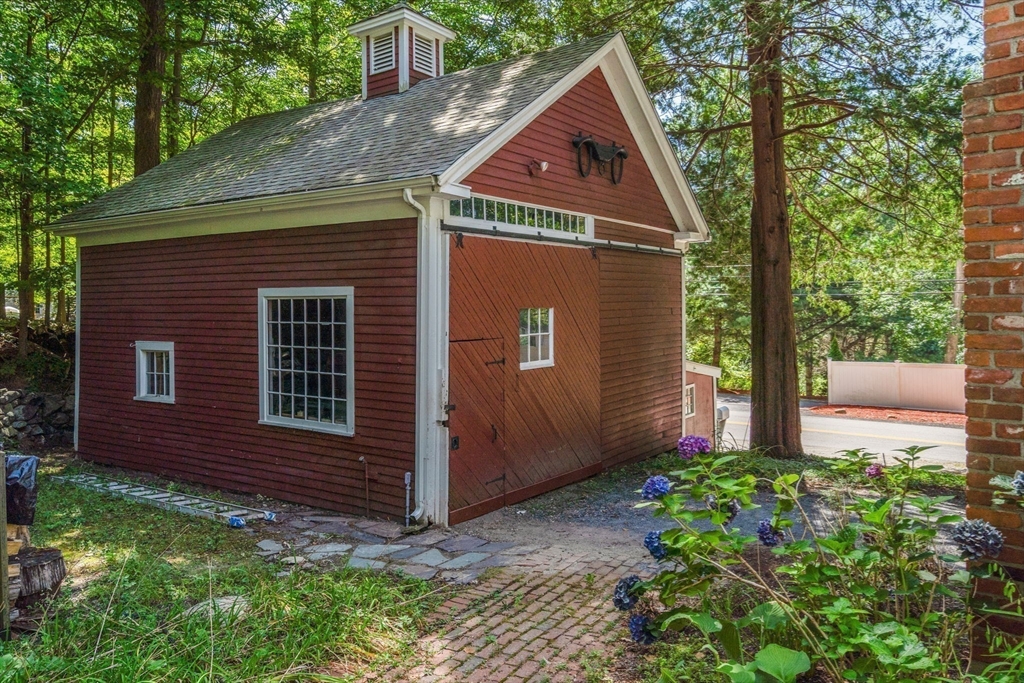 495 Edmands Road Framingham, MA 01701 - Photo 5 of 39 a front view of a house with garden