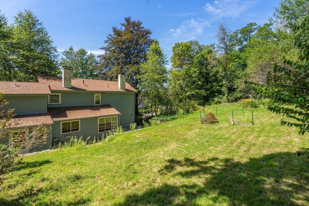 495 Edmands Road Framingham, MA 01701 - Photo 9 of 39 a backyard of a house with table and chairs