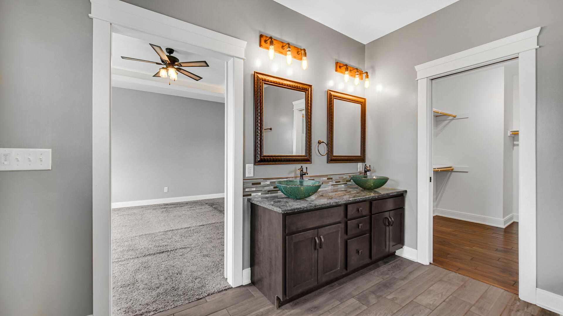 10427 North 600th Street West Demotte, IN 46310 - Photo 13 of 26 a spacious bathroom with a granite countertop sink and a mirror