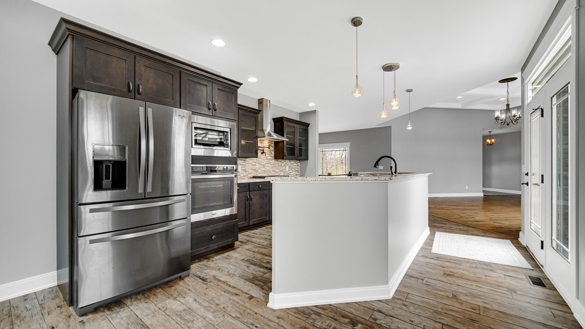 10427 North 600th Street West Demotte, IN 46310 - Photo 6 of 26 a kitchen with stainless steel appliances a refrigerator sink and cabinets
