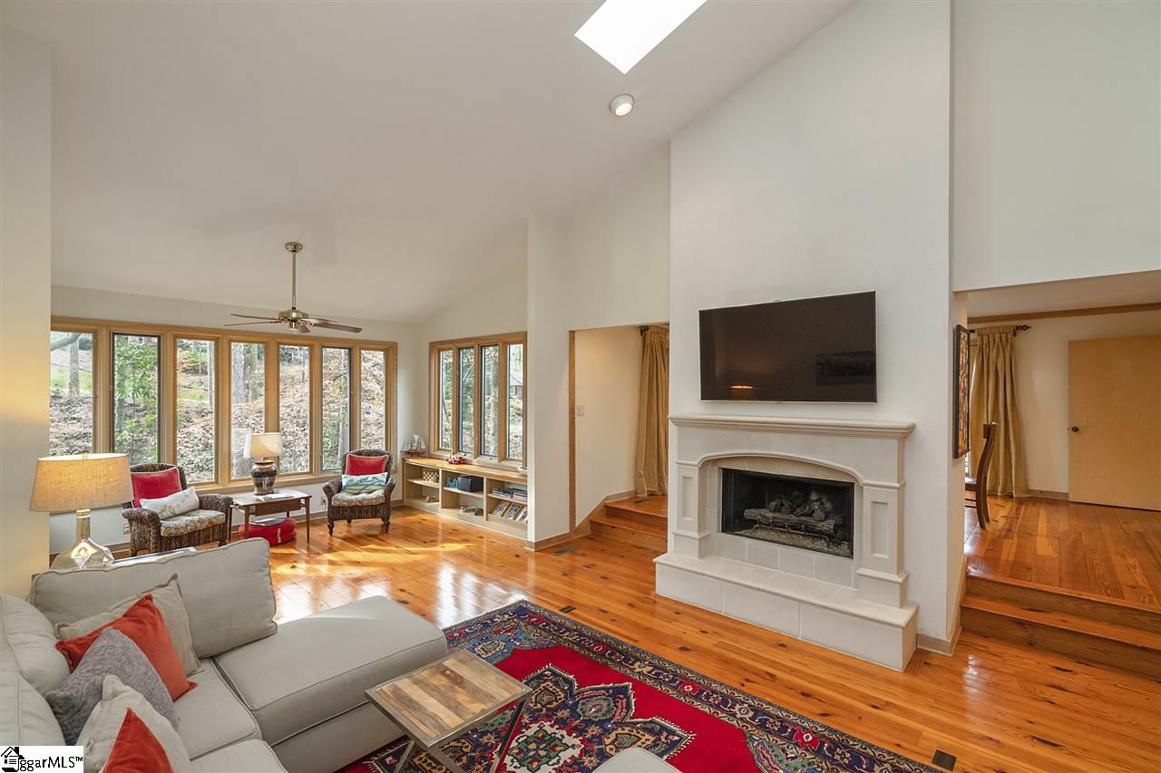 1111 Wembley Road Greenville, SC 29607 - Photo 2 of 35 Vaulted ceiling, skylights, heart of pine flooring, windows showcasing the natural beauty surround the home