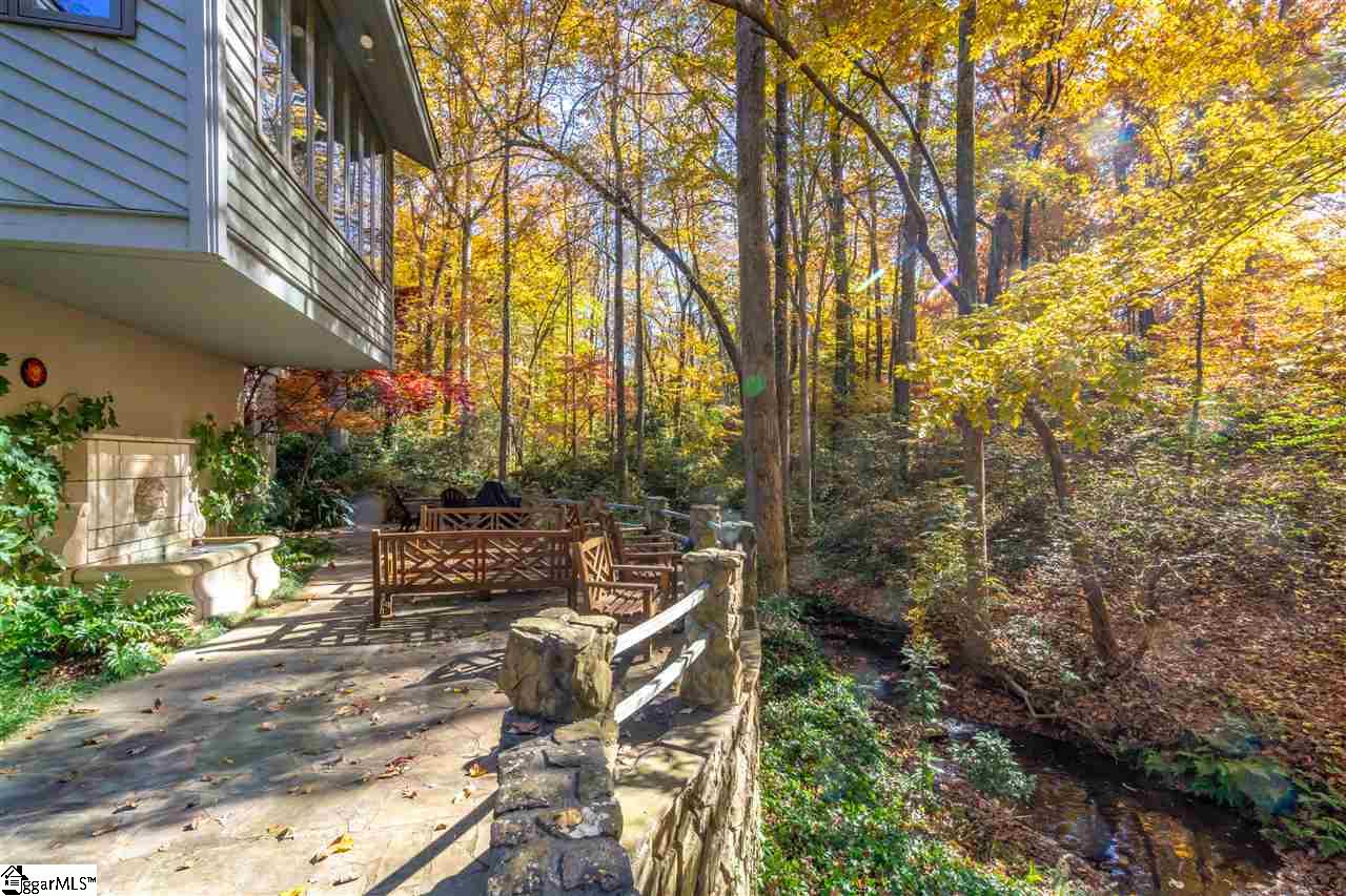 1111 Wembley Road Greenville, SC 29607 - Photo 25 of 35 Stone patio overlooking creek and 1.18 acre lot