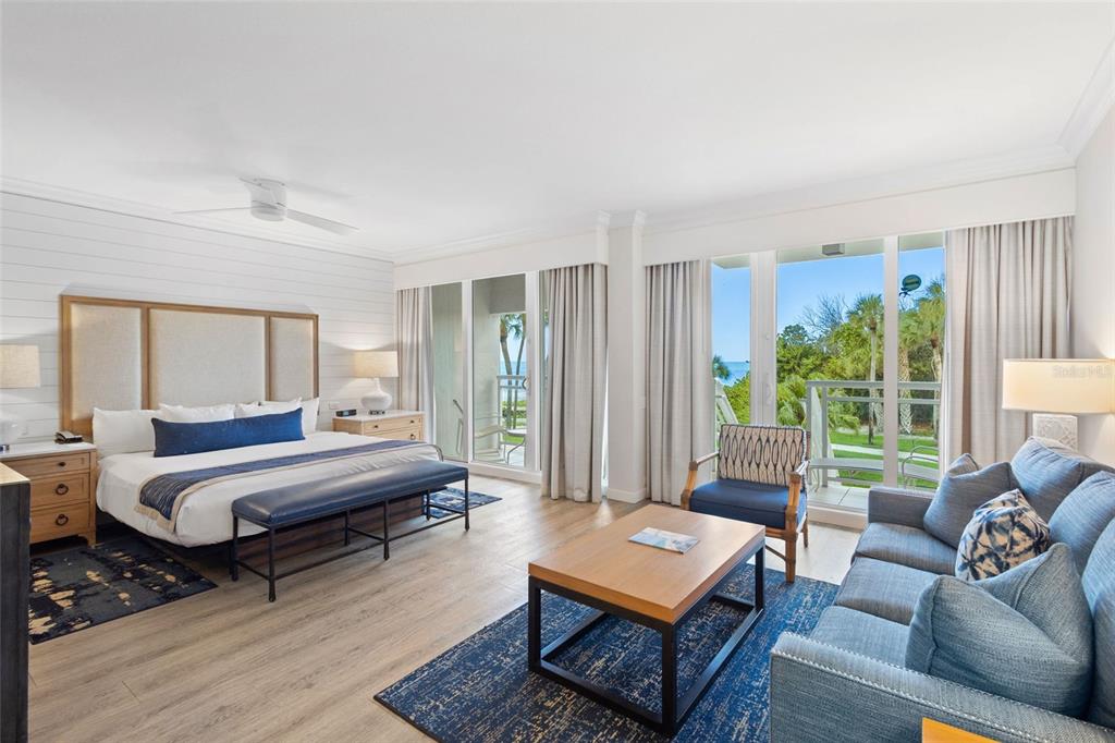 240 Sands Point Road, Unit 4104 Longboat Key, FL 34228 - Photo 5 of 47 a living room with furniture and a window