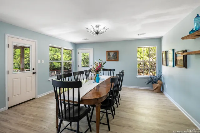 a view of a dining room with furniture window and wooden floor