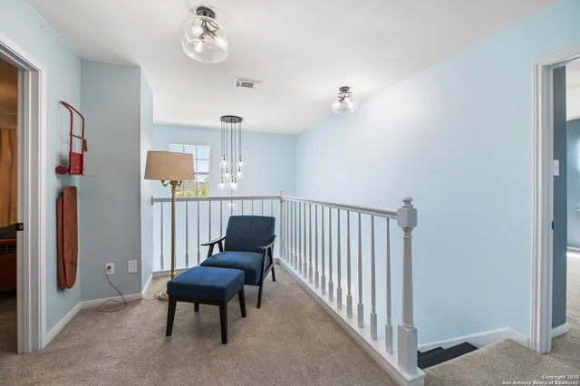 a room with furniture and a chair