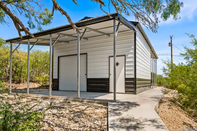 a view of a yard and tree s