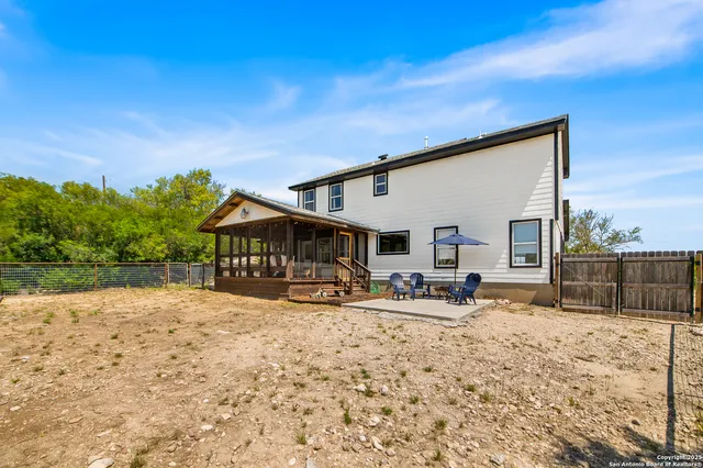 a aerial view of a house with a yard