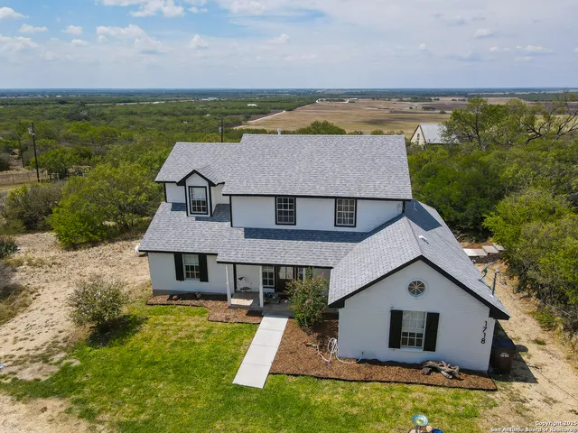 a lawn chairs sitting in a backyard