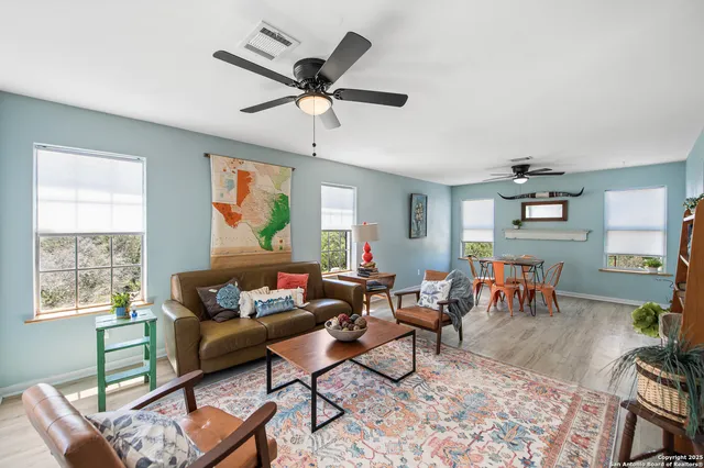 a living room with furniture and a window