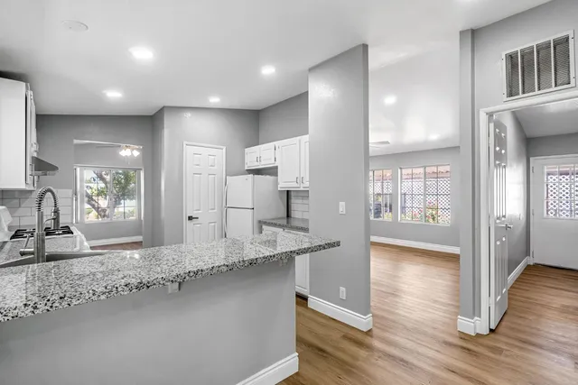 a bathroom with a sink and a large mirror