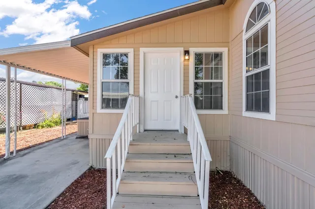 a view of staircase with white walls and windows