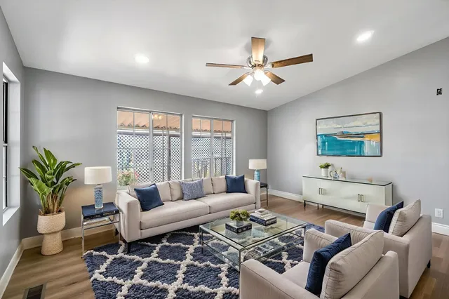 a living room with furniture and a large window