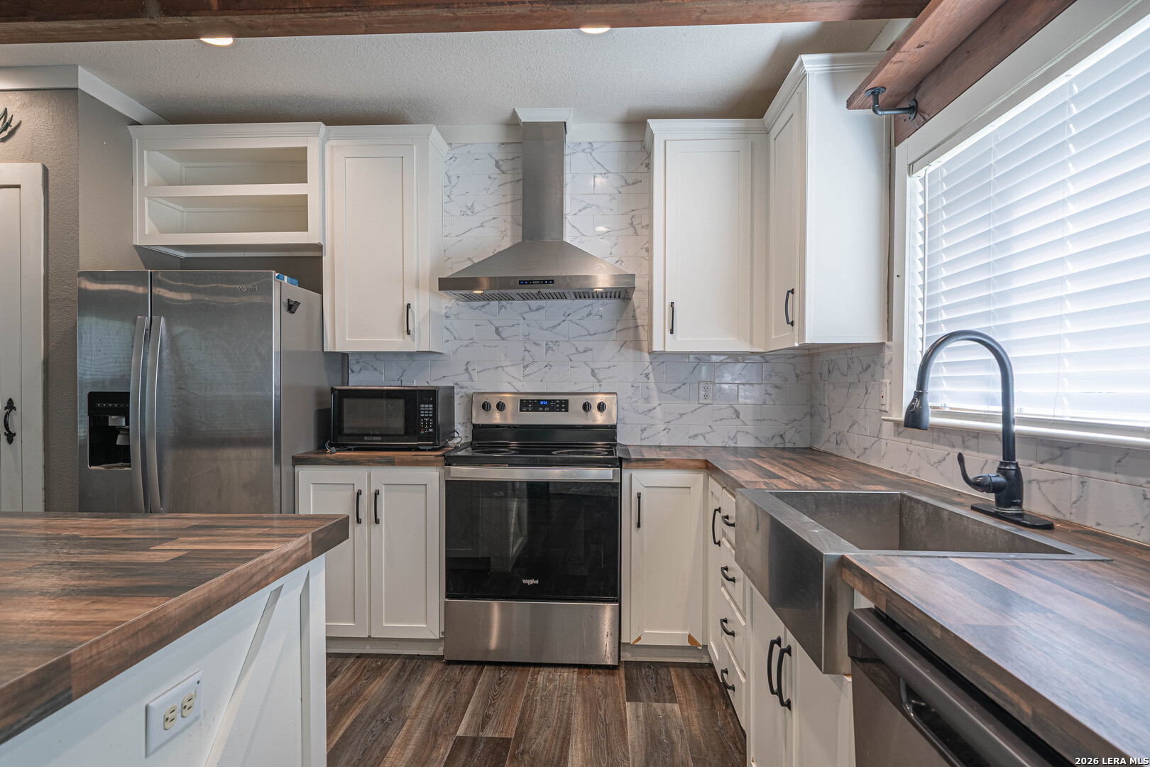 3433 Gander Slough Road Kingsbury, TX 78638 - Photo 5 of 23 a kitchen with a sink stove and cabinets