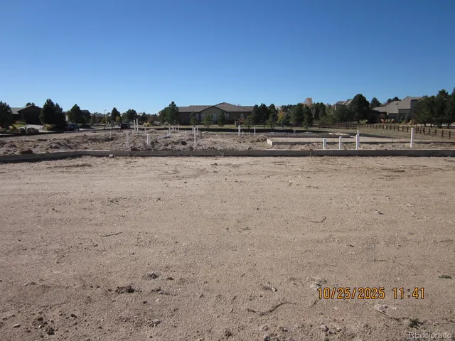 a view of a lake with houses in the back