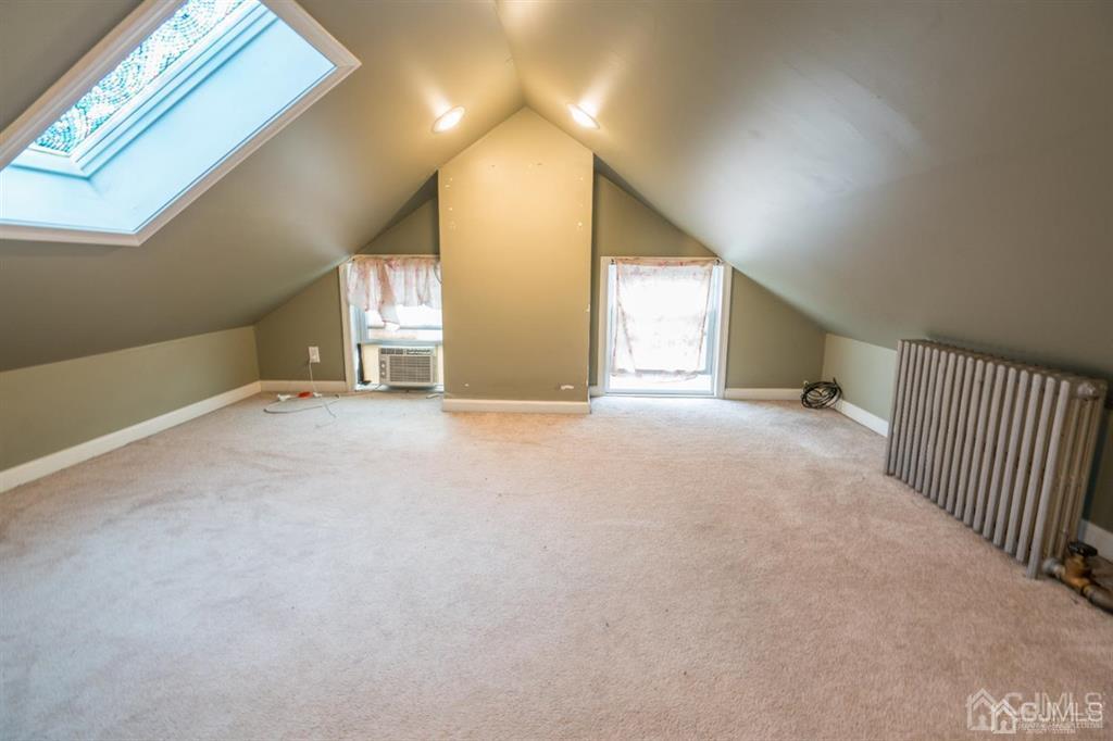 77 Center Street Perth Amboy, NJ 08861 - Photo 19 of 28 a view of a livingroom with a staircase