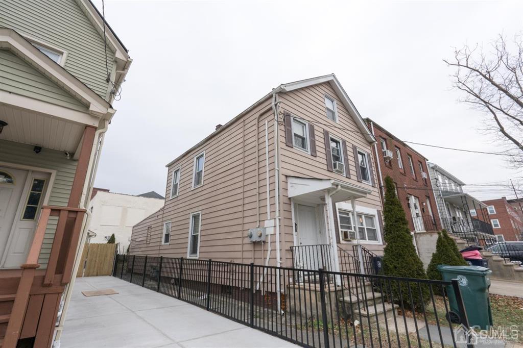 77 Center Street Perth Amboy, NJ 08861 - Photo 2 of 28 a view of a house with a fence