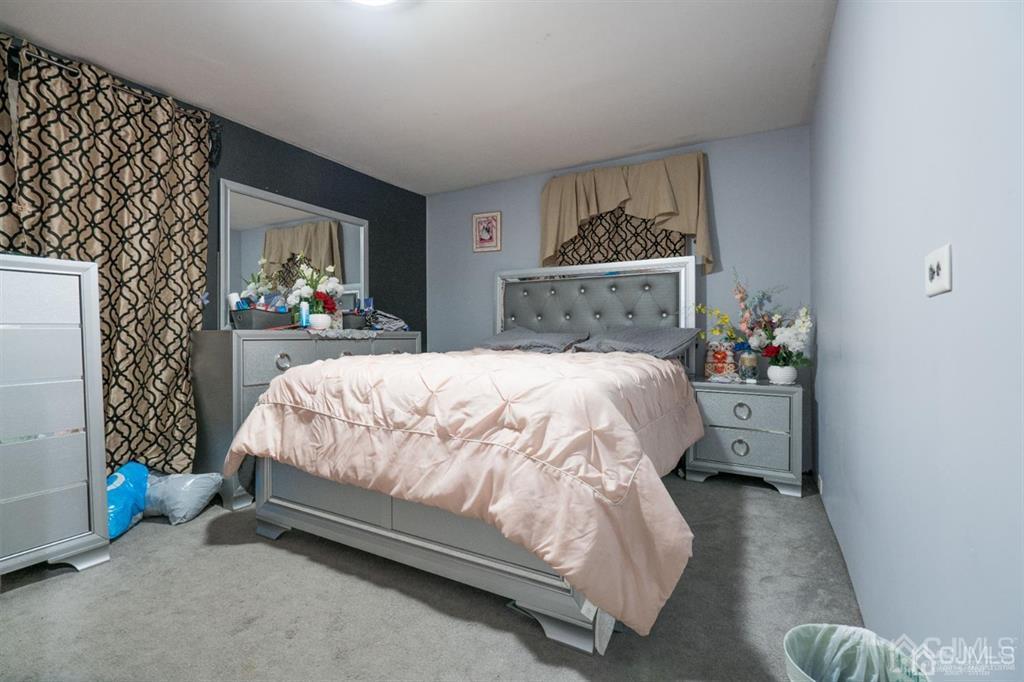77 Center Street Perth Amboy, NJ 08861 - Photo 26 of 28 a bedroom with a bed and a window
