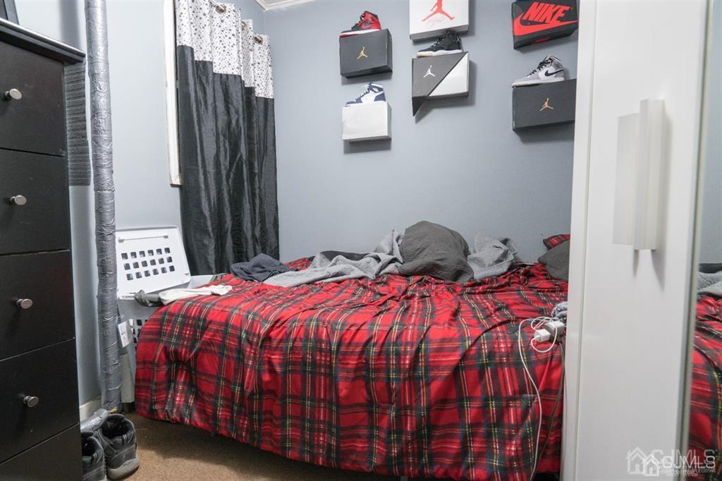 77 Center Street Perth Amboy, NJ 08861 - Photo 27 of 28 a bedroom with a bed and a closet