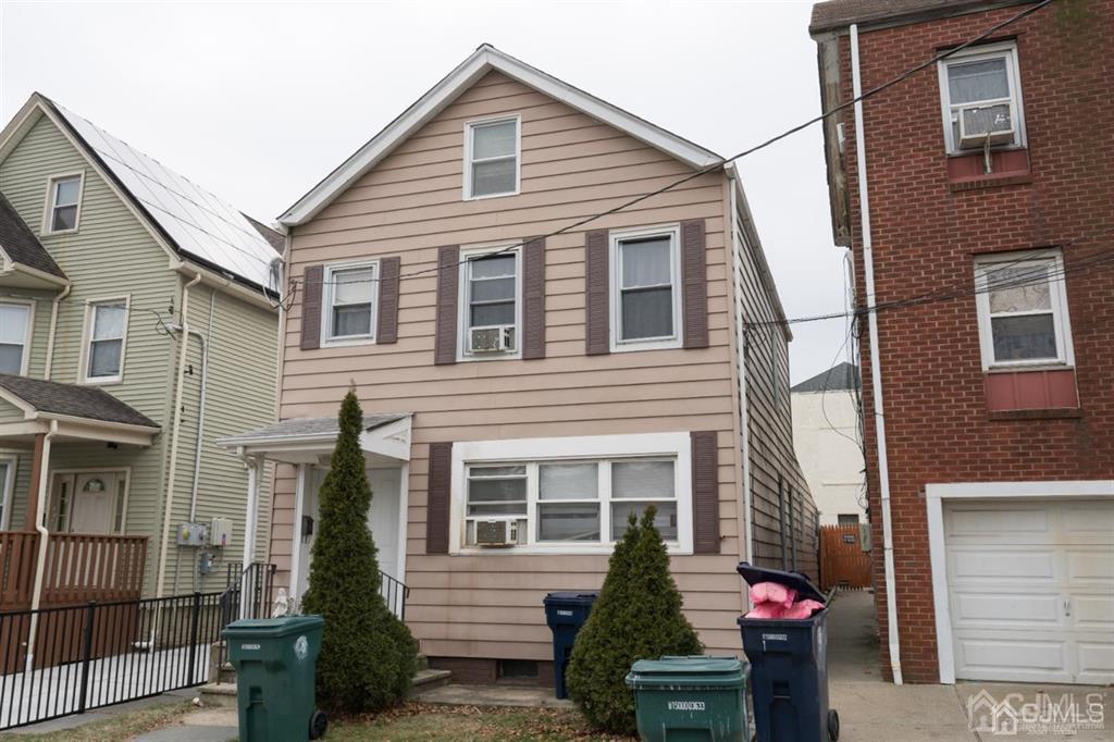 77 Center Street Perth Amboy, NJ 08861 - Photo 5 of 28 a view of a house with a bench in patio