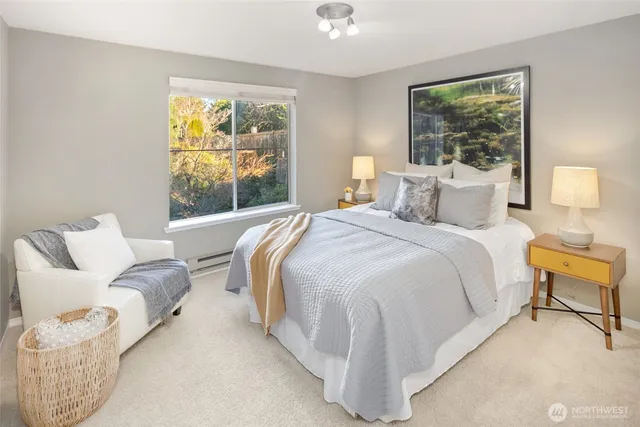 a bedroom with a bed and glass window