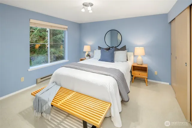 a bedroom with a bed and window