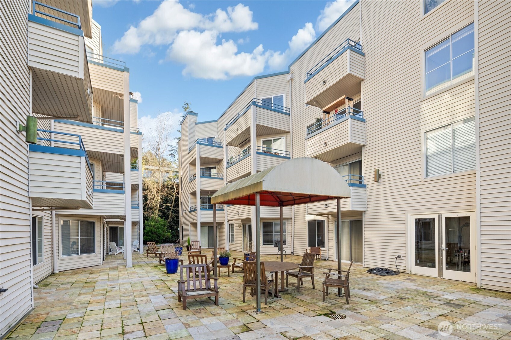 6960 California Avenue Southwest, Unit A308 Seattle, WA 98136 - Photo 16 of 22 a view of a building with sitting area
