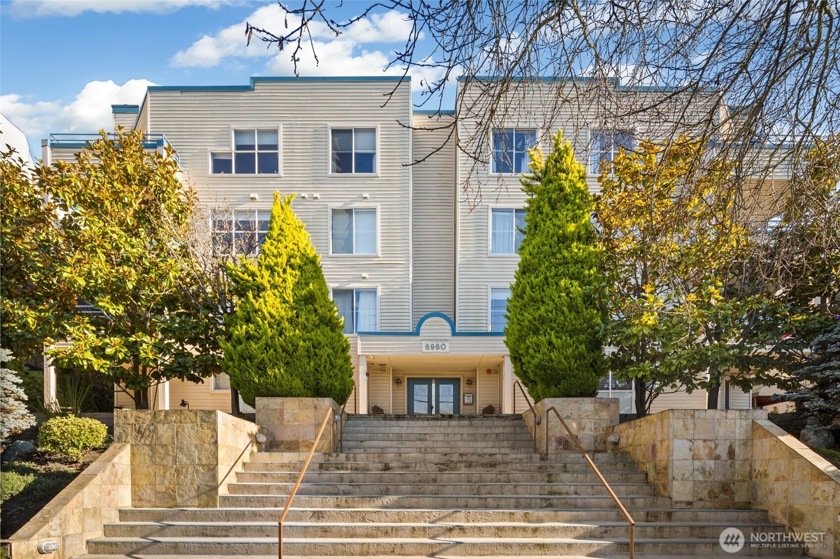 6960 California Avenue Southwest, Unit A308 Seattle, WA 98136 - Photo 2 of 22 front view of a house with a yard