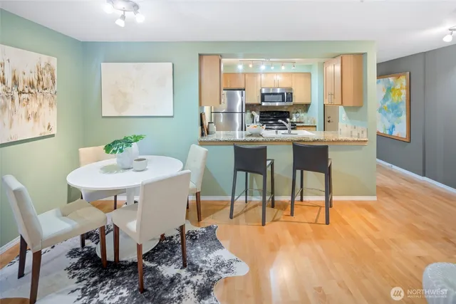 a view of a dining room with furniture window and wooden floor