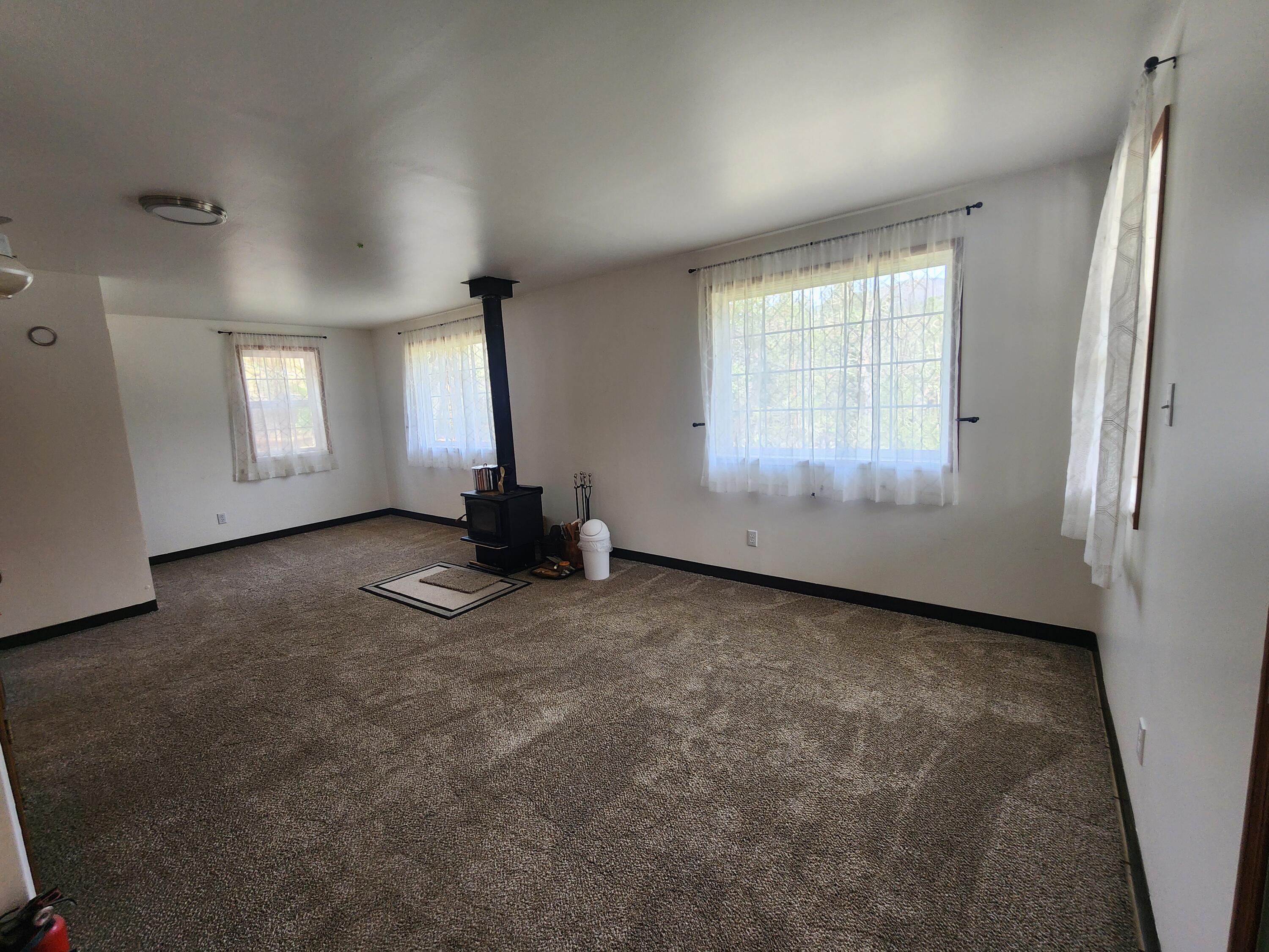 11238 East Evans Creek Road Rogue River, OR 97537 - Photo 5 of 29 an empty room with windows