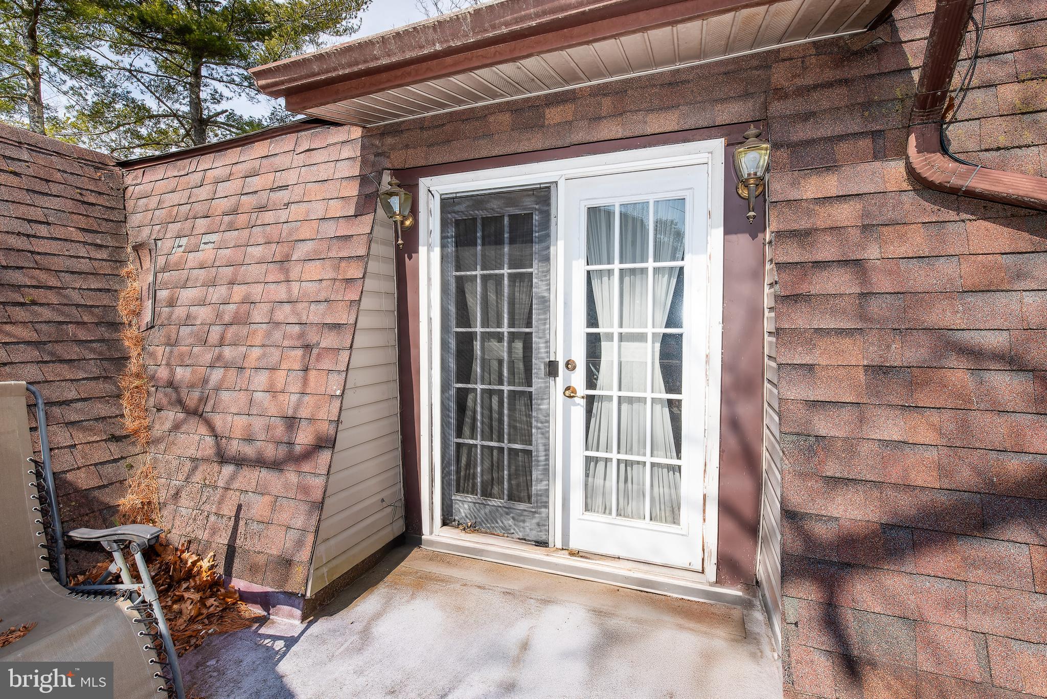 220 Chatsworth Tuckerton Road Chatsworth, NJ 08019 - Photo 22 of 64 a view of front door of house with a window
