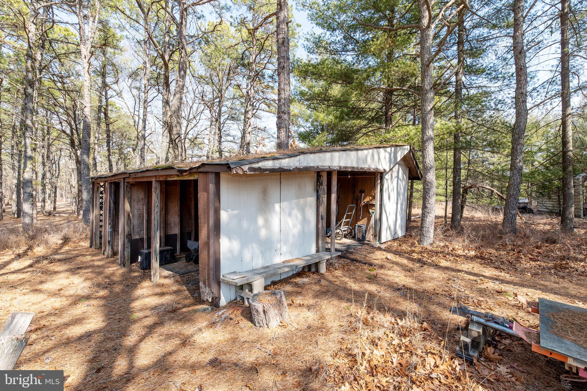 220 Chatsworth Tuckerton Road Chatsworth, NJ 08019 - Photo 59 of 64 a view of a house with a large tree and wooden fence