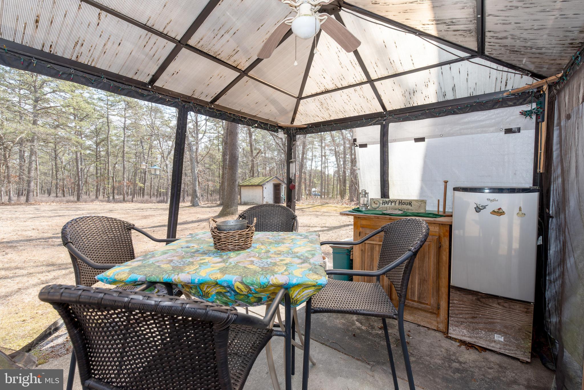 220 Chatsworth Tuckerton Road Chatsworth, NJ 08019 - Photo 63 of 64 a outdoor dining space with furniture and outdoor view