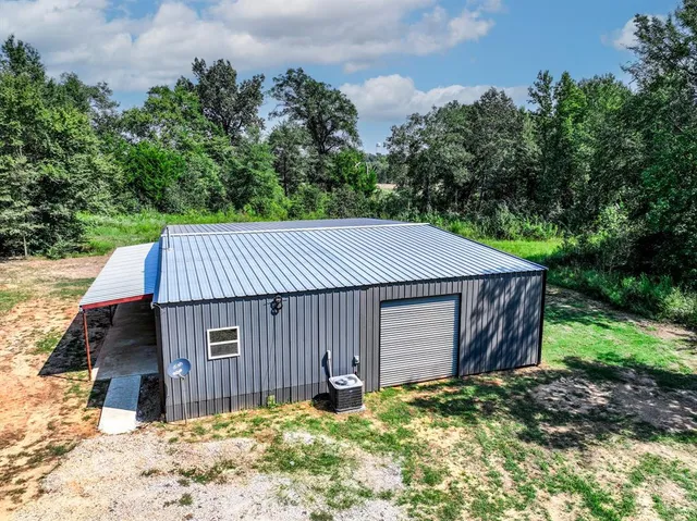a house with trees in the background