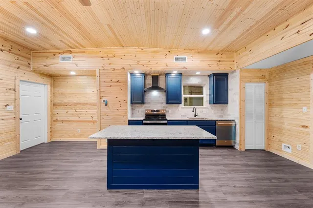 a kitchen with a stove and a sink
