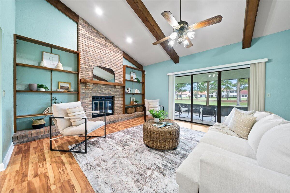 271 Sandy Run Melbourne, FL 32940 - Photo 11 of 41 a living room with furniture and a fireplace