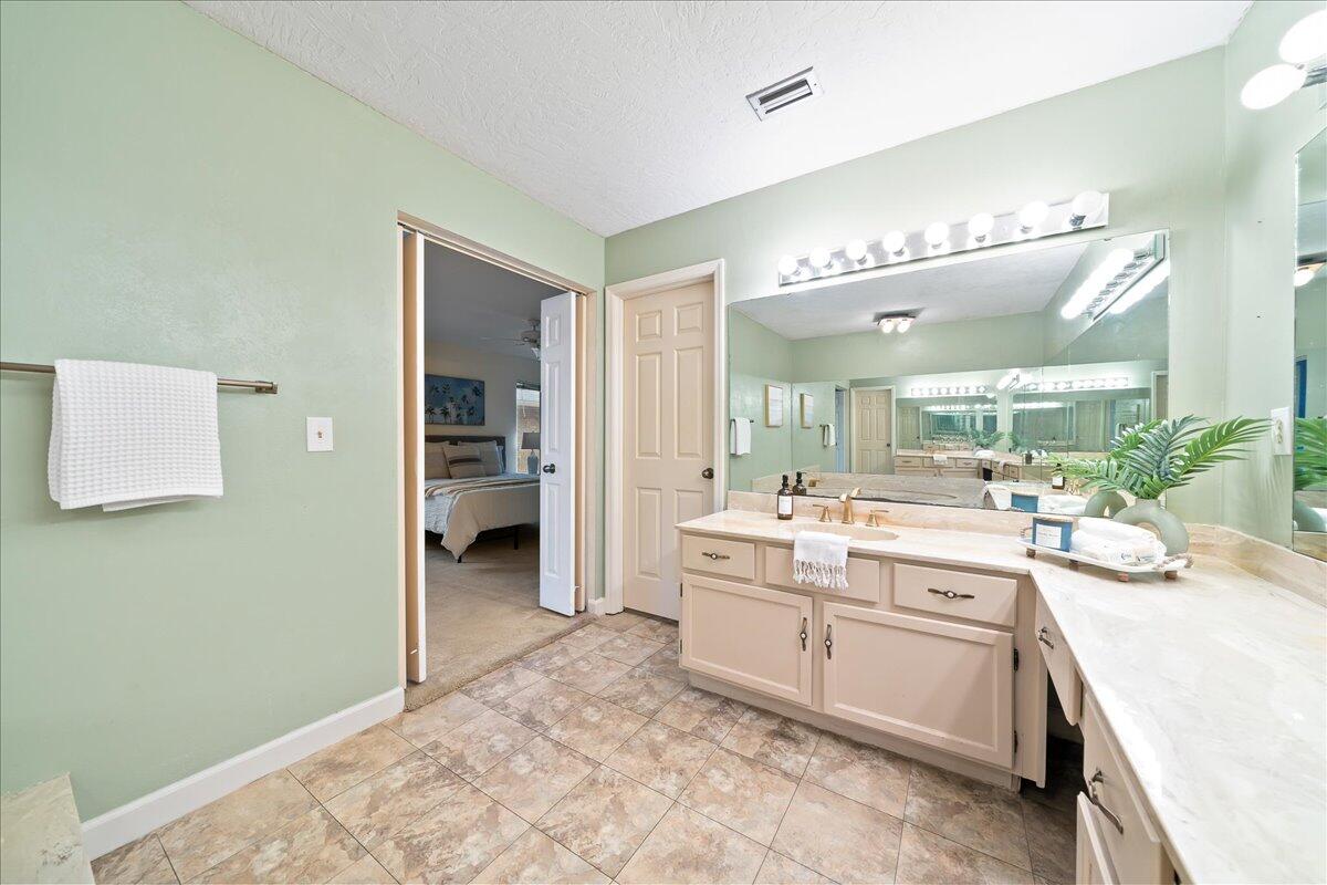271 Sandy Run Melbourne, FL 32940 - Photo 20 of 41 a kitchen with a sink and cabinets
