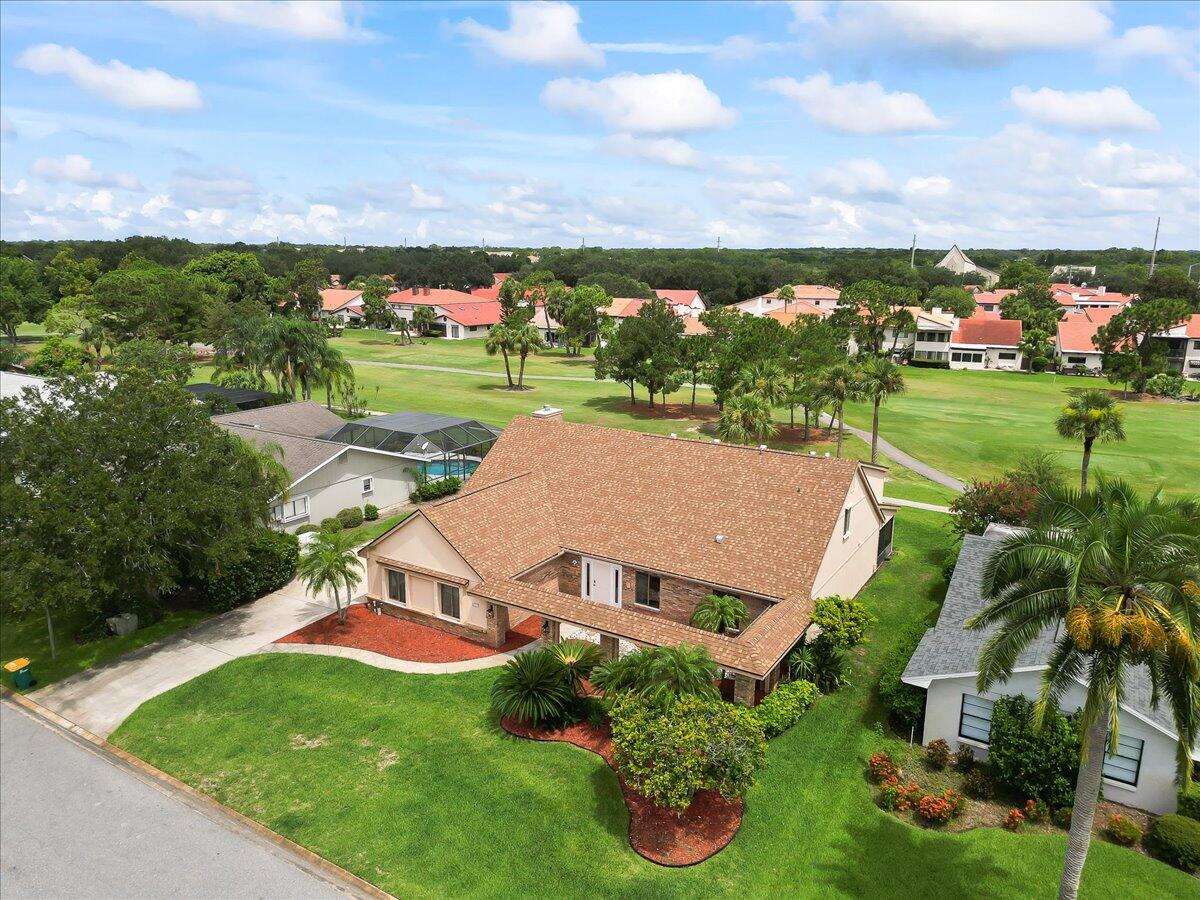 271 Sandy Run Melbourne, FL 32940 - Photo 2 of 41 an aerial view of a house with garden space and street view