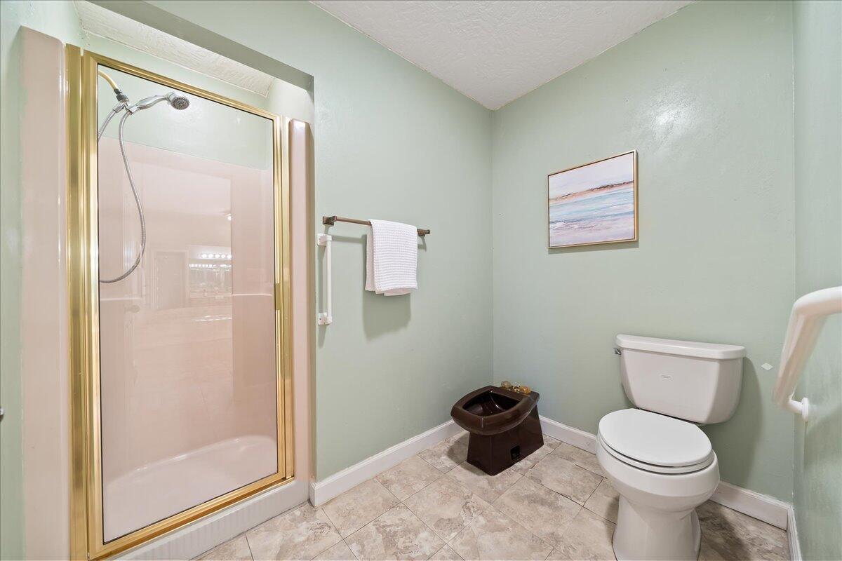 271 Sandy Run Melbourne, FL 32940 - Photo 21 of 41 a bathroom with a toilet and a shower
